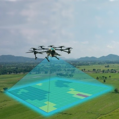 drone flying over field, with stylized pixels within drone field of view to symbolize retrieved data